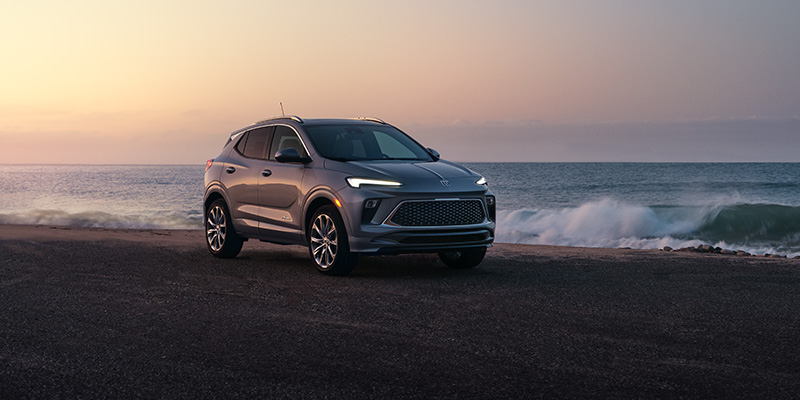 a gray 2026 Buick Encore GX is parked near a body of water near Ballston Spa,  NY