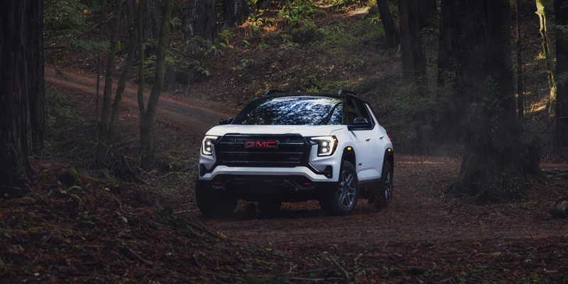 New 2026 GMC Terrain Parked in Forest in the front profile look