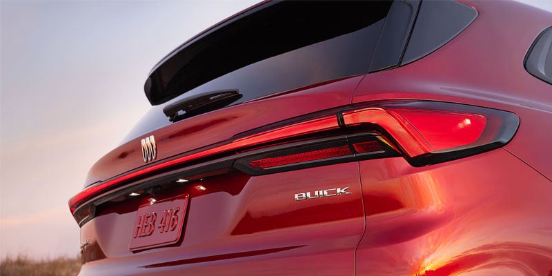 Red SUV rear view highlighting sleek taillights, rear design, and modern styling details.