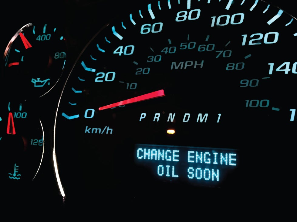 Vehicle dashboard displaying a "Change Engine Oil Soon" maintenance reminder.