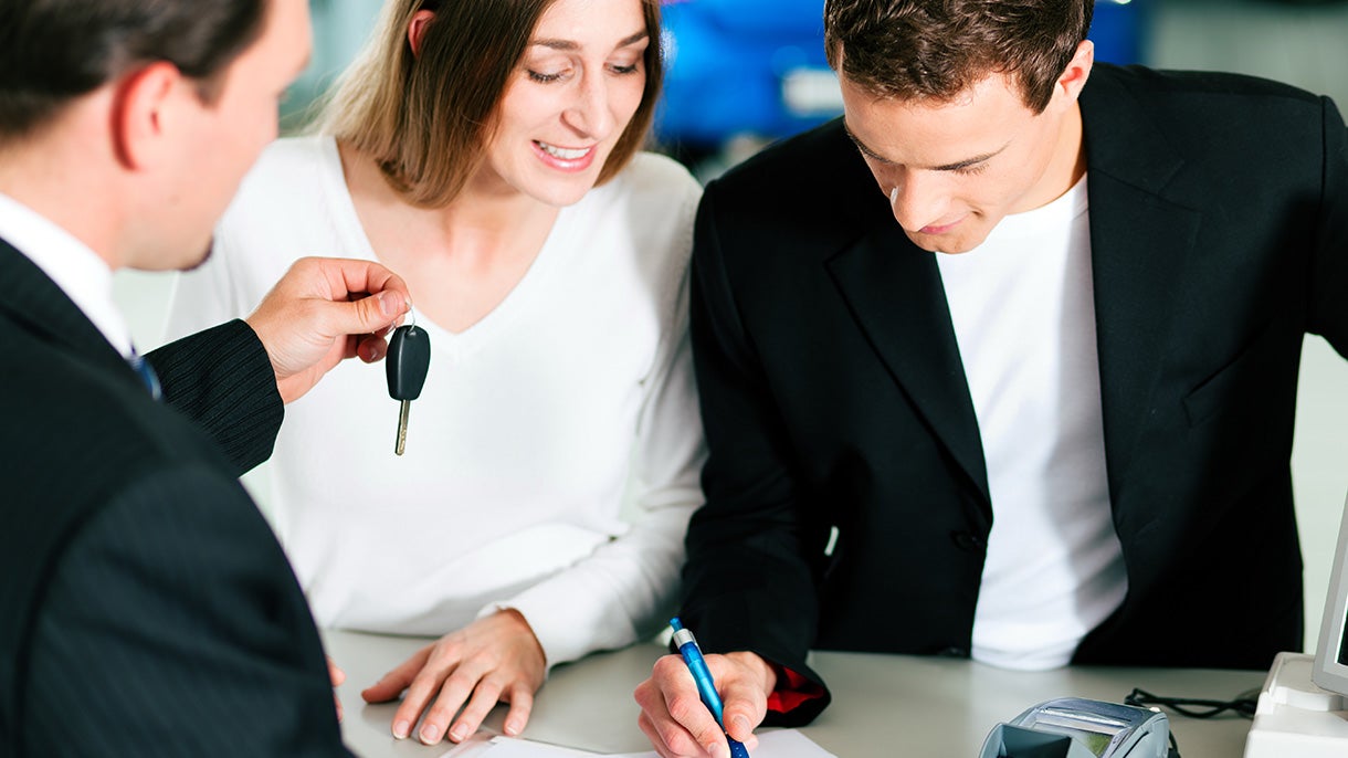 Couple signing a Finance Documents